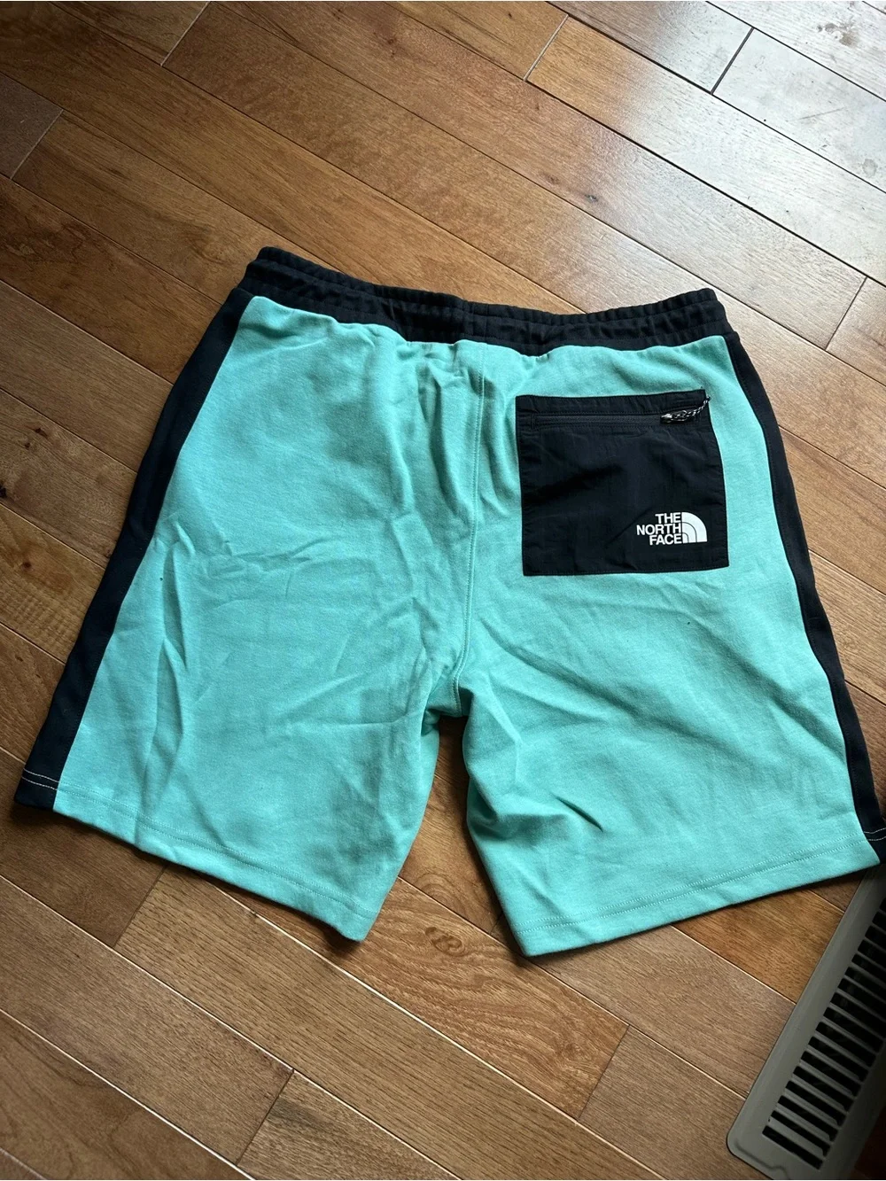 The North Face Men's Mint Green Athletic Shorts with Black Panels